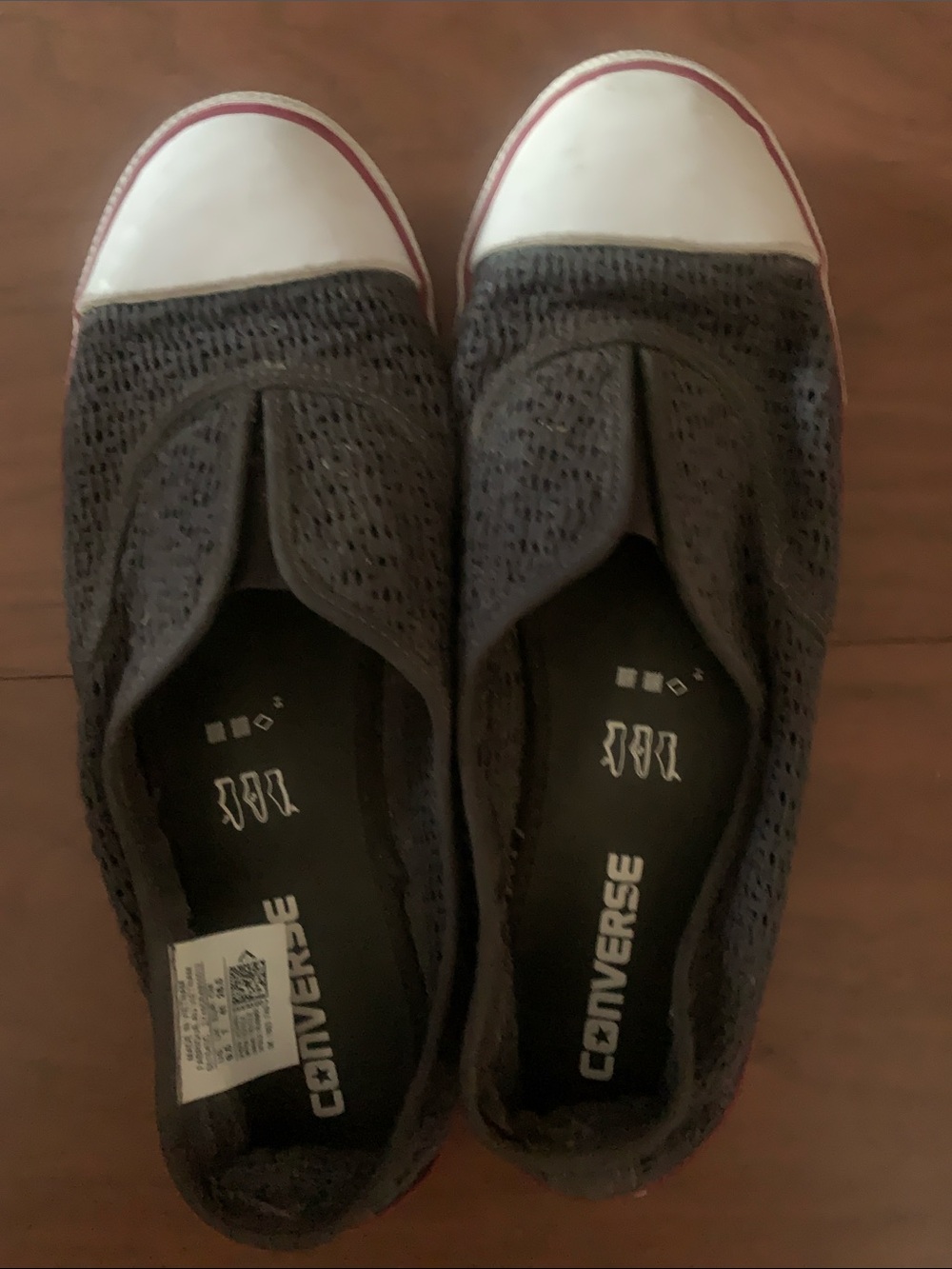 Converse Women's Slip-On Sneakers in Black with White Toe and Red Trim